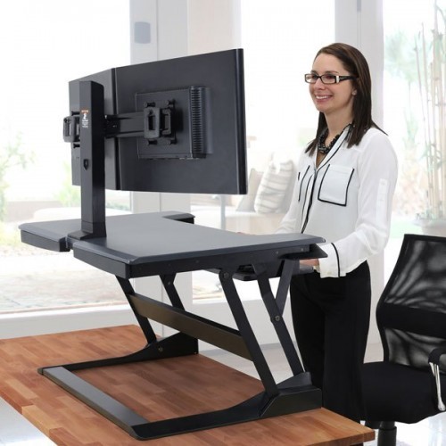 Ergotron Workfit TL Height Adjustable Desk Converter Dual monitor Arm in use
